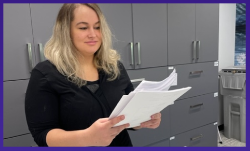 An employee of Independent Texas Registered Agent sorts through mail in the Austin office.